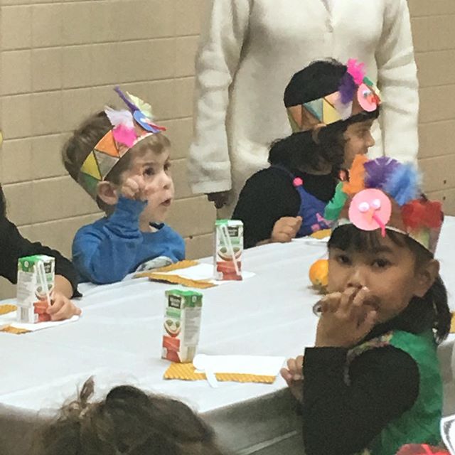 Giving thanks with construction paper head dresses.