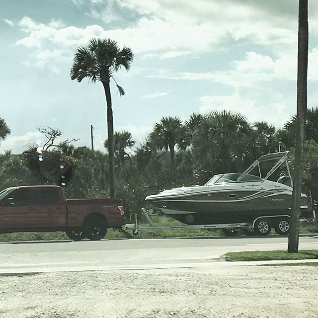 Watching our new boat be delivered.